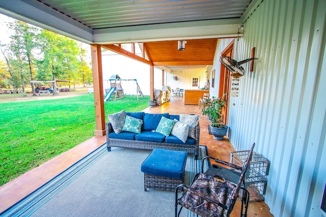 view of patio with an outdoor living space and a playground