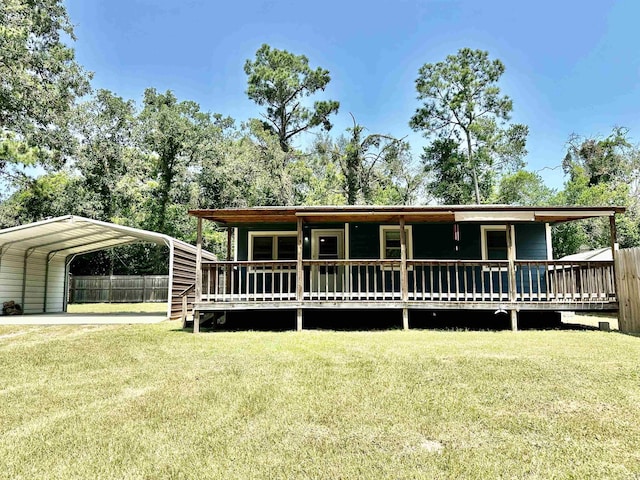 view of front of house with a front lawn and a carport