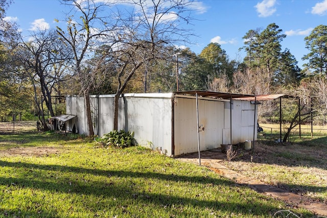 view of outdoor structure featuring a yard