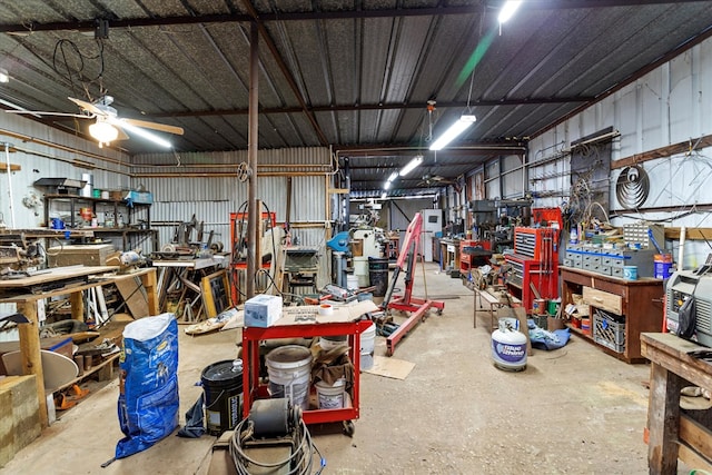 garage featuring a workshop area and ceiling fan