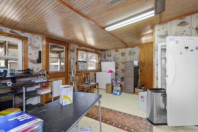 interior space featuring cooling unit, a healthy amount of sunlight, and wood ceiling