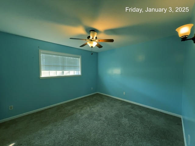 carpeted spare room featuring ceiling fan