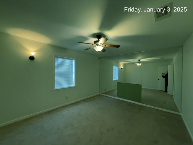 interior space with ceiling fan, a closet, and carpet floors