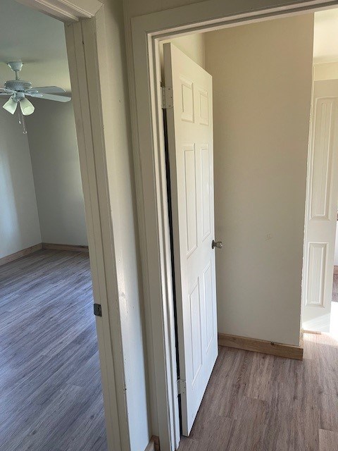 corridor featuring hardwood / wood-style flooring