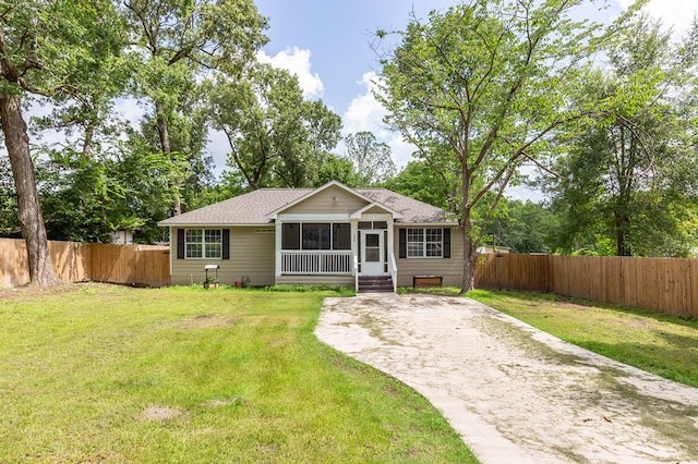 225 Jerri St, Lufkin, TX 75901 - view of front facade featuring a shingled roof and a sunroom