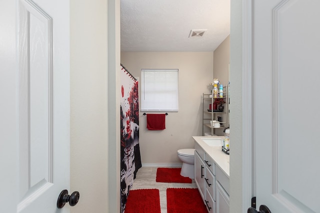 225 Jerri St, Lufkin, TX 75901 - full bathroom featuring vanity, a textured ceiling, and a shower with shower curtain