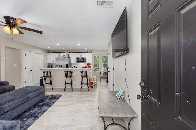 225 Jerri St, Lufkin, TX 75901 - living room featuring ceiling fan and recessed lighting