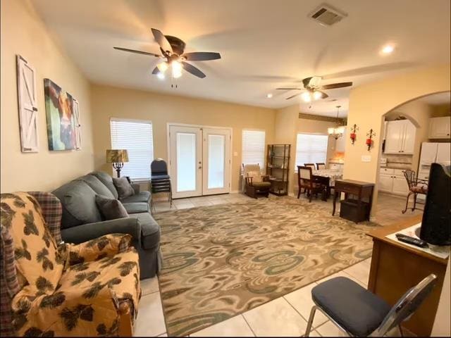 522 Mount Carmel Rd, Hudson, TX 75904 - tiled living room featuring a ceiling fan, french doors, arched walkways, and recessed lighting