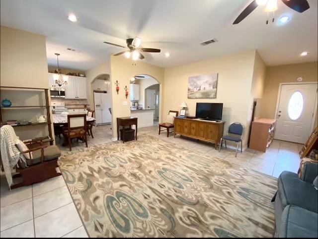 522 Mount Carmel Rd, Hudson, TX 75904 - living area featuring ceiling fan, arched walkways, light tile patterned floors, recessed lighting, and a chandelier