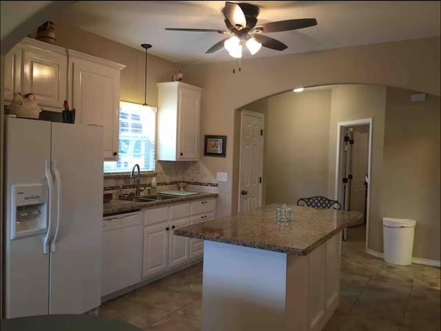 522 Mount Carmel Rd, Hudson, TX 75904 - kitchen featuring white appliances, arched walkways, a sink, white cabinetry, and a ceiling fan