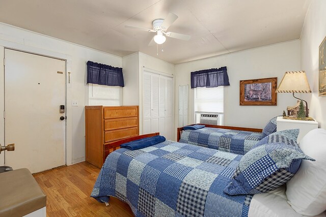 998 Winston 8 Ranch Rd, Lufkin, TX 75904 - bedroom with wood finished floors, multiple windows, a closet, and a ceiling fan