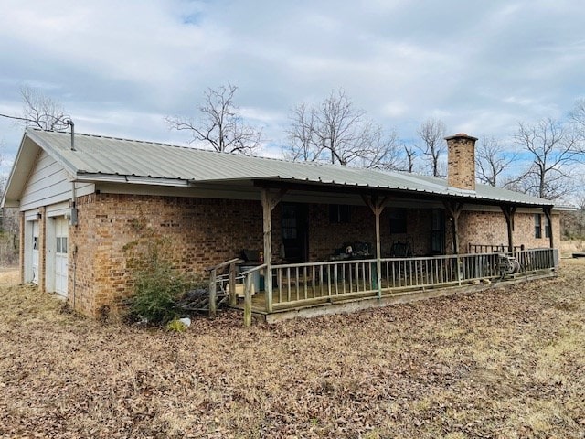 rear view of house with a porch