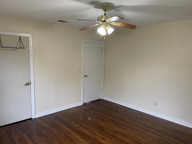 unfurnished bedroom featuring ceiling fan and dark hardwood / wood-style flooring