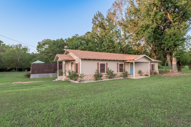 ranch-style home with a front yard