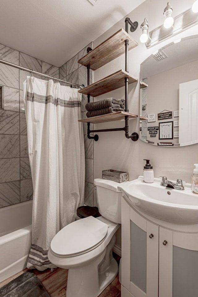 full bathroom with vanity, toilet, and shower / bath combo