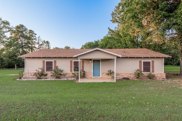 ranch-style home featuring a front yard