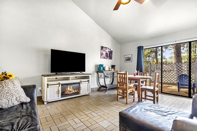 living room with high vaulted ceiling and ceiling fan