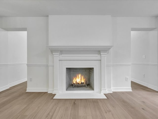 107 Bending Oak Dr, Lufkin, TX 75904 - detailed view of wood finished floors and a fireplace with flush hearth