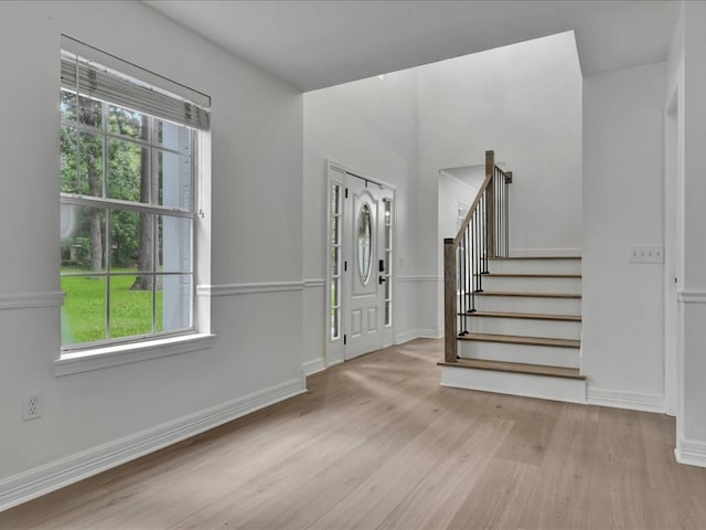 107 Bending Oak Dr, Lufkin, TX 75904 - entrance foyer featuring wood finished floors, stairway, and plenty of natural light