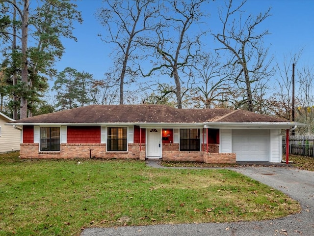 single story home with a garage and a front yard