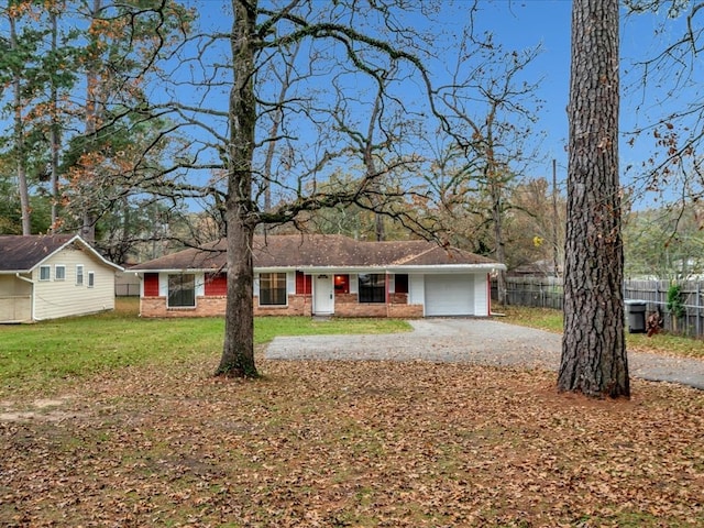 single story home featuring a garage and a front lawn