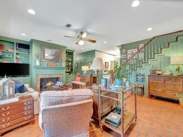 2211 Copeland St, Lufkin, TX 75904 - living area featuring recessed lighting, brick floor, visible vents, a ceiling fan, and a fireplace
