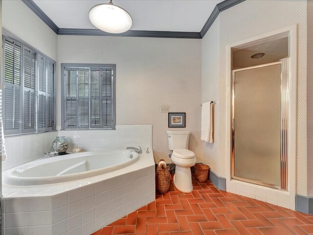 2211 Copeland St, Lufkin, TX 75904 - bathroom featuring crown molding, toilet, a shower stall, brick floor, and a bath