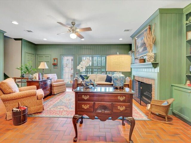 2211 Copeland St, Lufkin, TX 75904 - living area with brick floor, visible vents, ceiling fan, and a brick fireplace