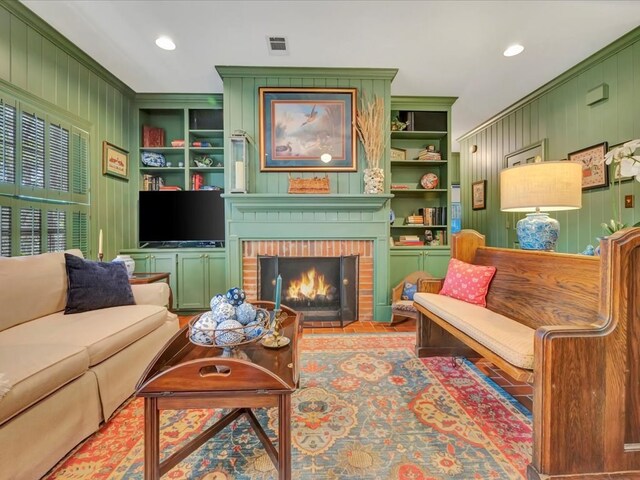 2211 Copeland St, Lufkin, TX 75904 - living room featuring visible vents, recessed lighting, a fireplace, and built in shelves