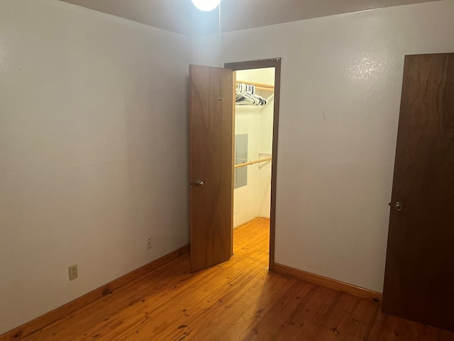 empty room with light hardwood / wood-style flooring