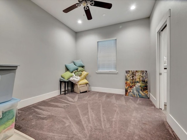 sitting room featuring carpet floors and ceiling fan