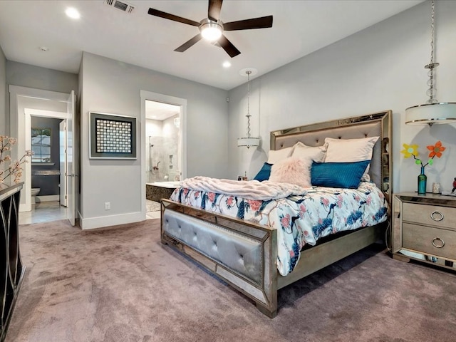 bedroom with ceiling fan, carpet, and ensuite bathroom