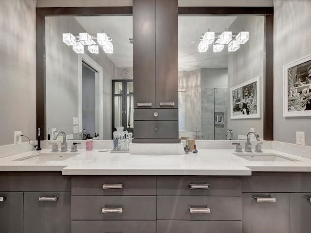 bathroom with walk in shower and vanity