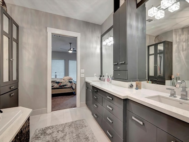 bathroom with ceiling fan, vanity, and tile patterned flooring