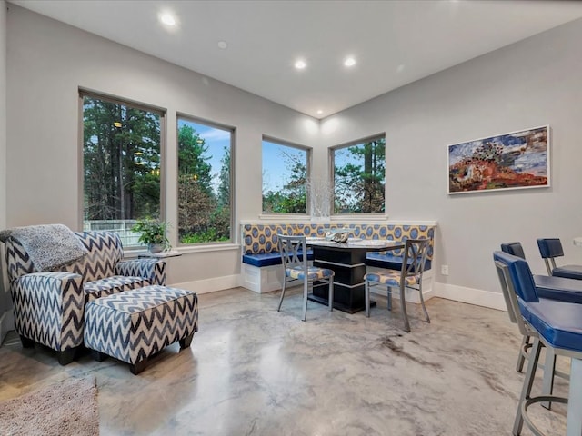 dining room with concrete floors