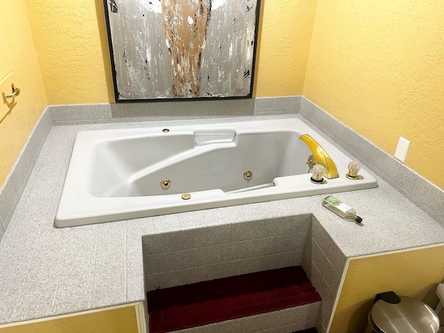 bathroom featuring a tub to relax in