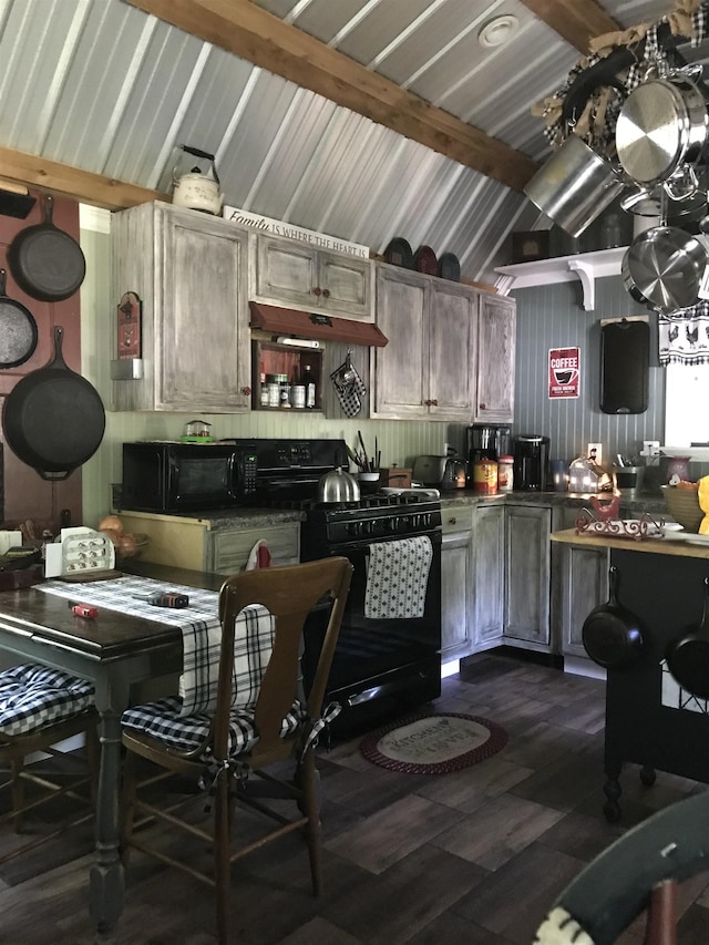 kitchen featuring black appliances, lofted ceiling with beams, and dark hardwood / wood-style flooring