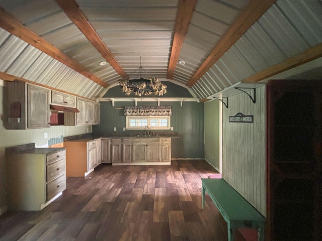 kitchen with a notable chandelier, dark hardwood / wood-style floors, lofted ceiling with beams, and sink