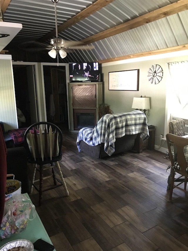 bedroom featuring ceiling fan, lofted ceiling with beams, and dark hardwood / wood-style floors