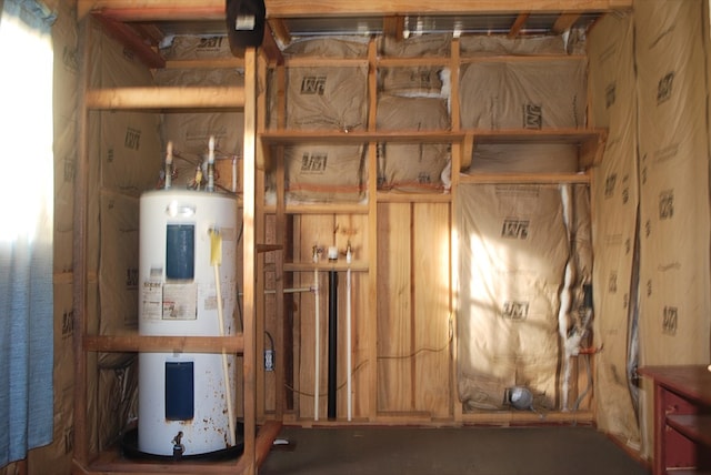 utility room featuring electric water heater