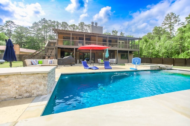 view of swimming pool with fence, a fenced in pool, an outdoor living space, and a patio area