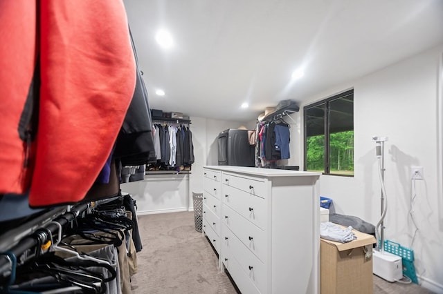 walk in closet featuring carpet flooring