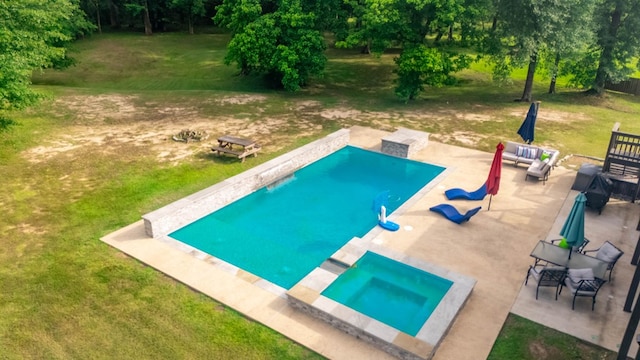 outdoor pool with a lawn, a patio, and an outdoor living space
