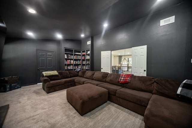 living area with visible vents, carpet flooring, built in features, and recessed lighting