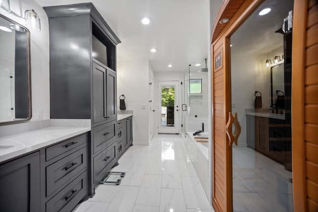 bathroom with a stall shower, vanity, baseboards, marble finish floor, and recessed lighting