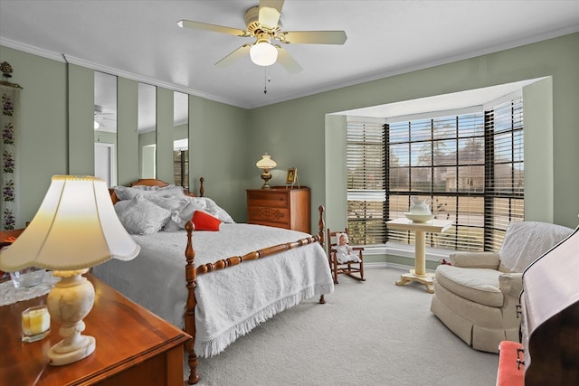 bedroom featuring carpet, ceiling fan, and ornamental molding