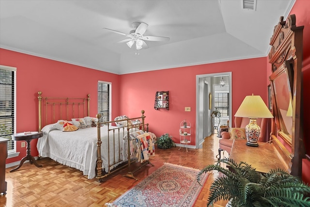 bedroom featuring ceiling fan, crown molding, and light parquet flooring