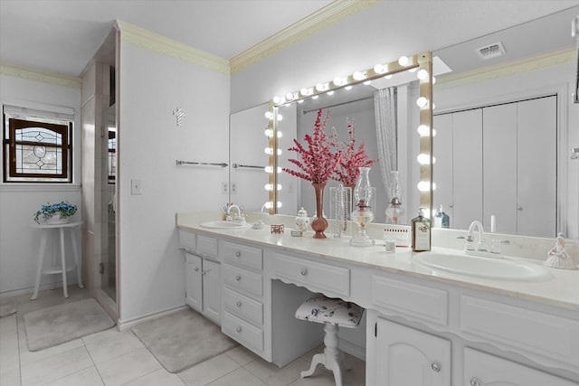 bathroom with tile patterned floors, crown molding, vanity, and walk in shower