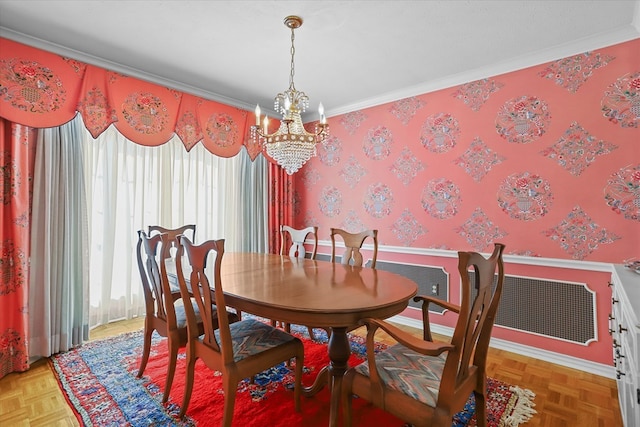 dining space featuring ornamental molding, parquet floors, and a chandelier