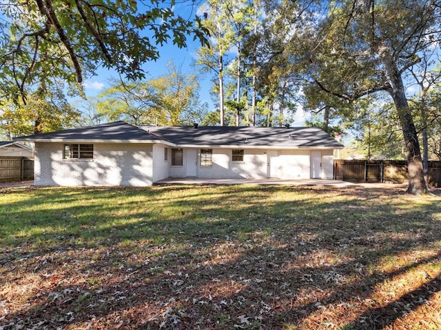 single story home featuring a patio and a front yard